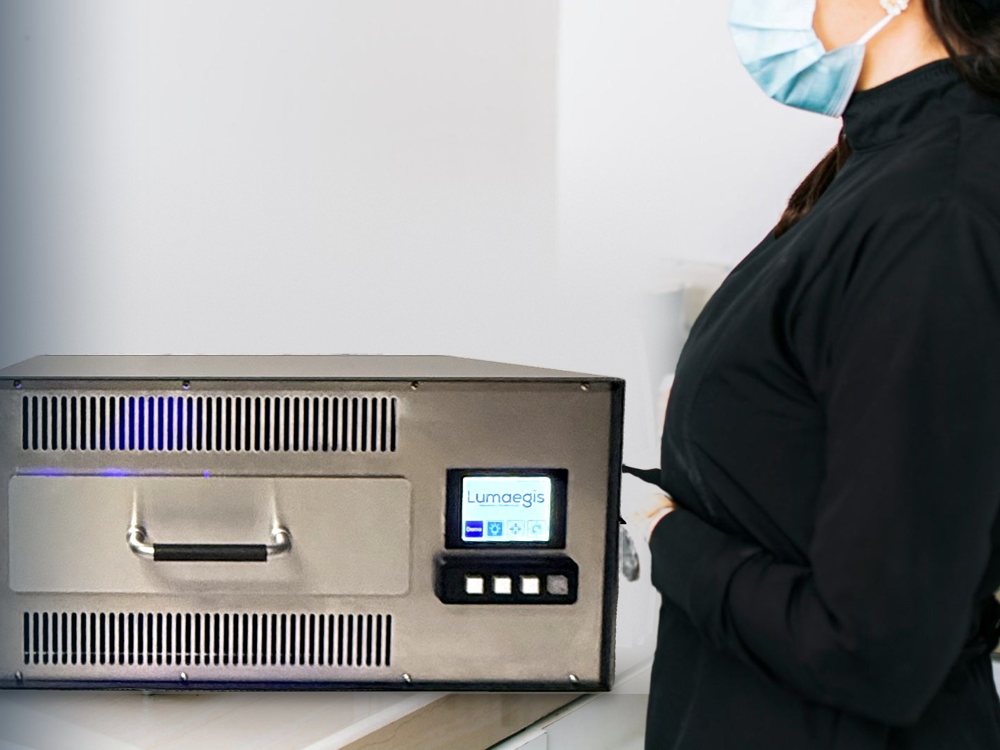 Clinician beside a RadBox sterilizer
