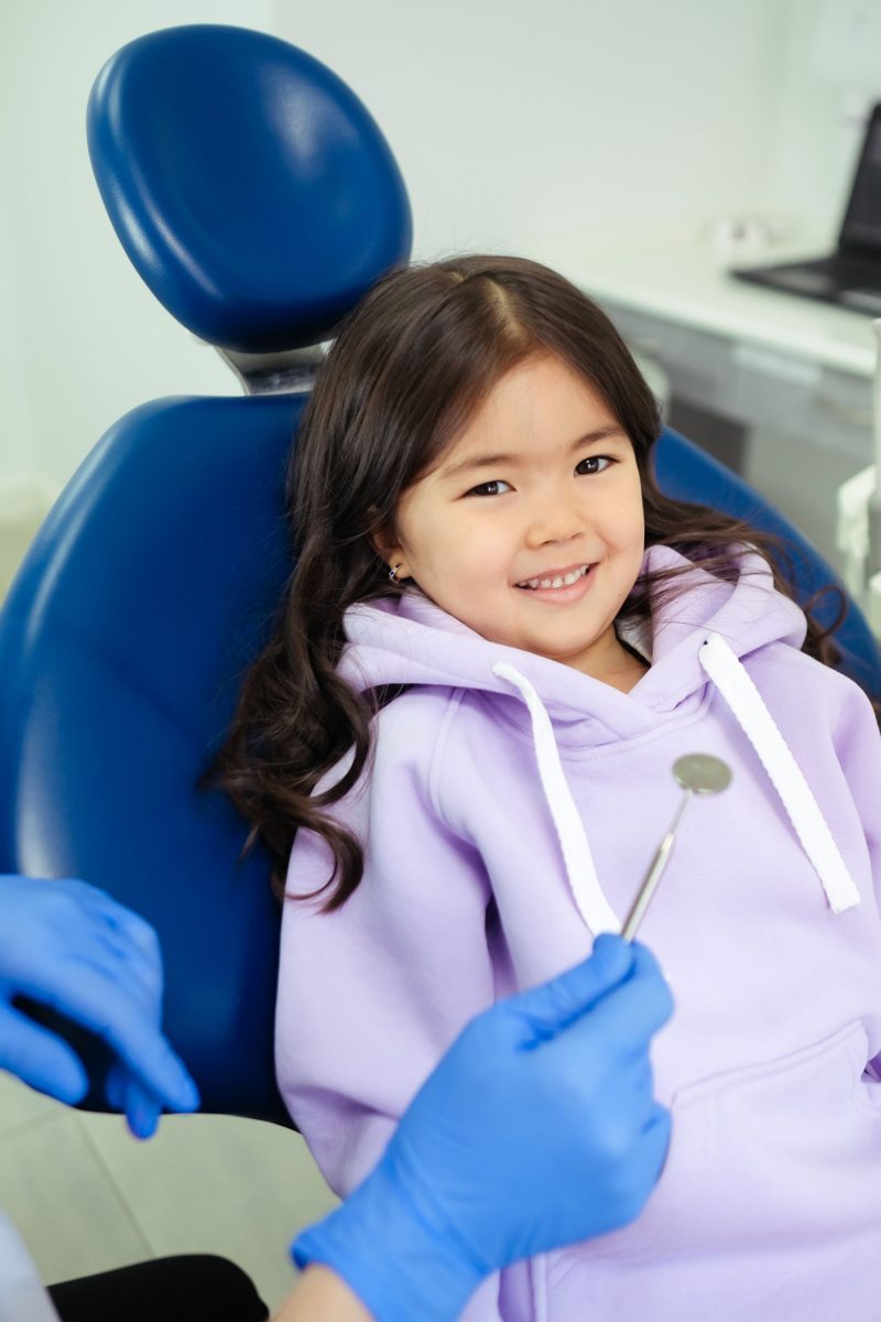 Smiling child in a dental chair